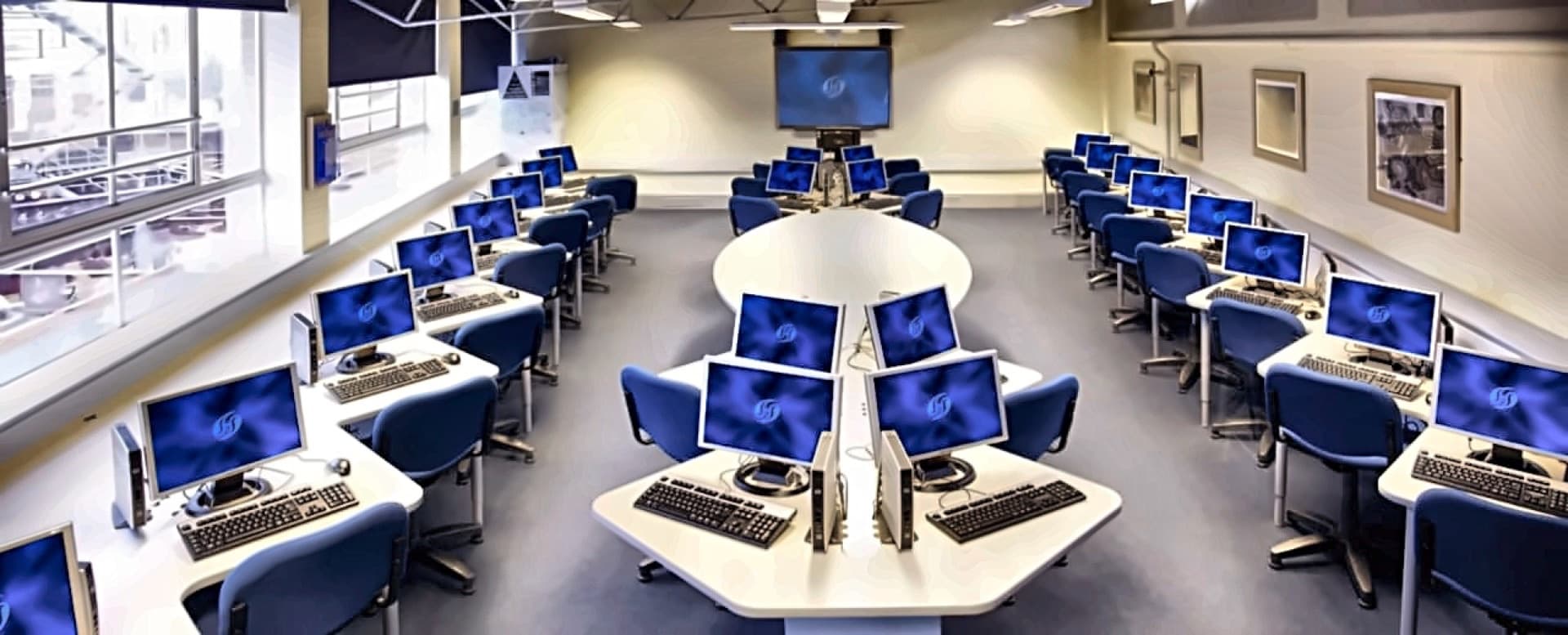Computer-based test centre with rows of networked workstations